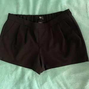 Black pleated dress shorts